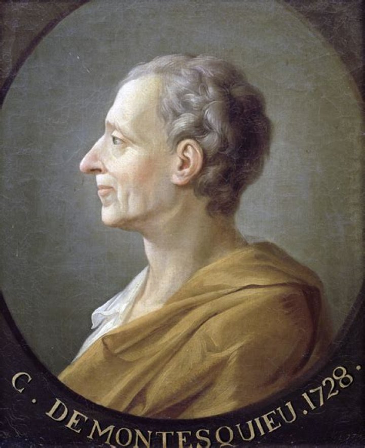 How did Baron de Montesquieu contribute to the Enlightenment?