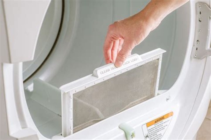 How do I change the door on my Whirlpool Duet dryer?