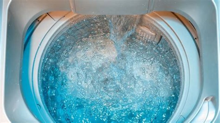 How do I increase the water level in my washing machine?