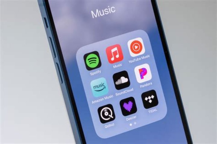 How do I use the Music app on my iPhone?