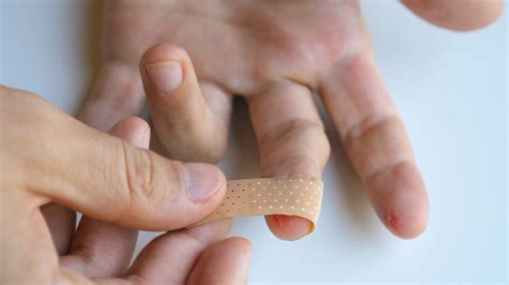 How do you apply a fingertip bandage?