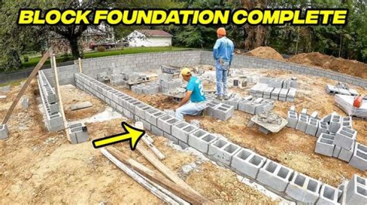 How do you build a cinder block wall on a concrete slab?