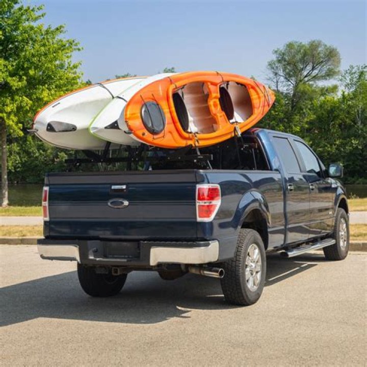 How do you carry two kayaks on a car without a roof rack?