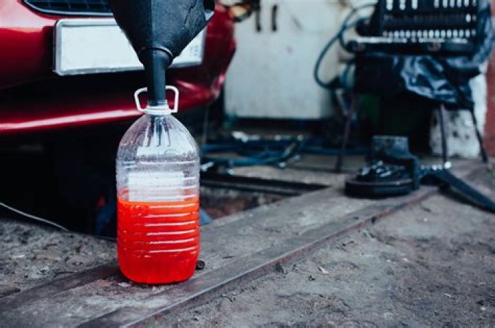 How do you clean antifreeze off asphalt?