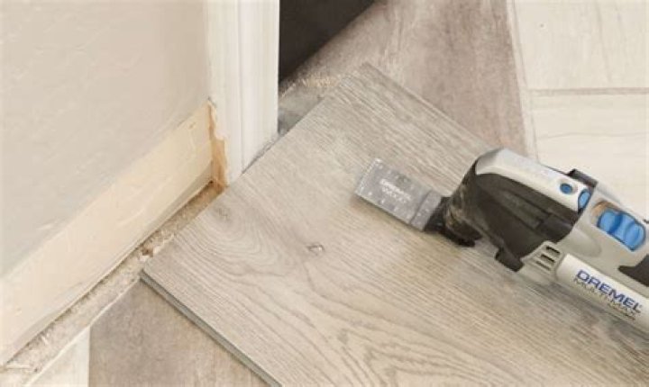 How do you cut laminate flooring around door jambs?