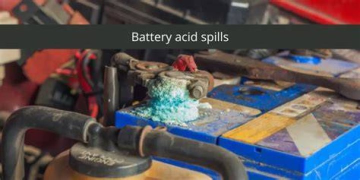 How do you dispose of battery acid spills?