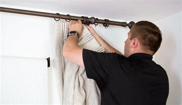 How do you install curtain rod anchors?