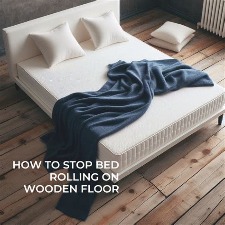 How do you keep a bed from rolling on a wooden floor?