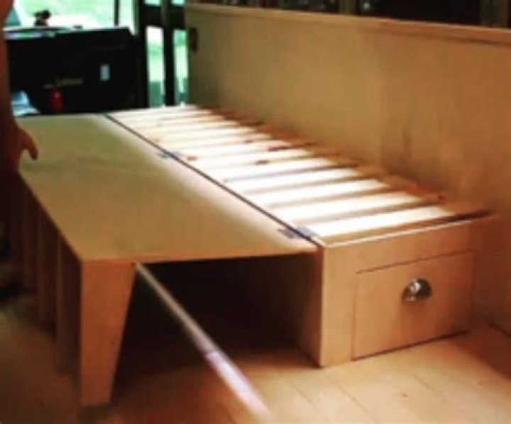How do you make a caravan table into a bed?