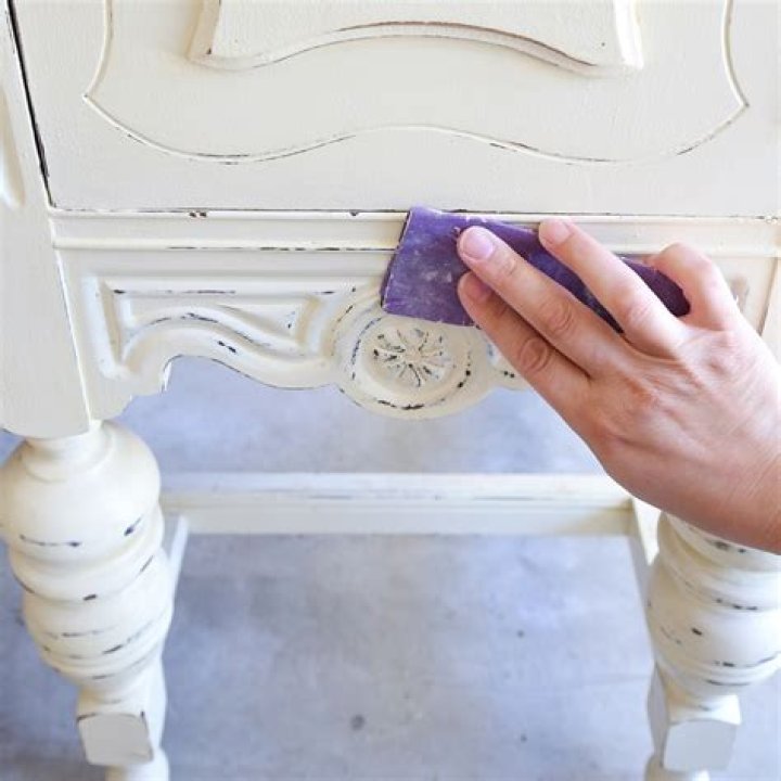 How do you paint furniture to make it look distressed?