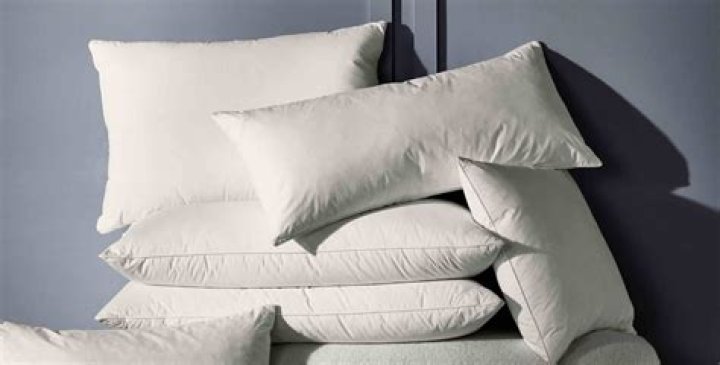 How do you wash feather pillows at home?