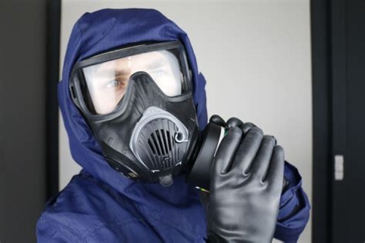 How does a gas mask protect someone?