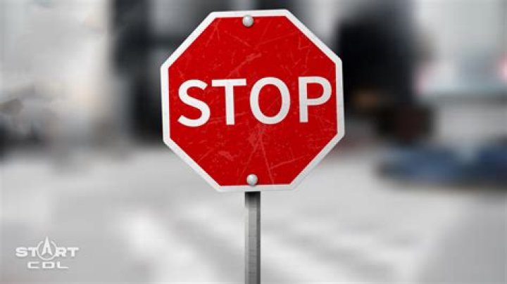 How long do you have to stop at a stop sign?