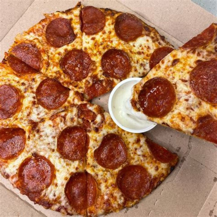 How many does a medium Domino's Pizza feed?