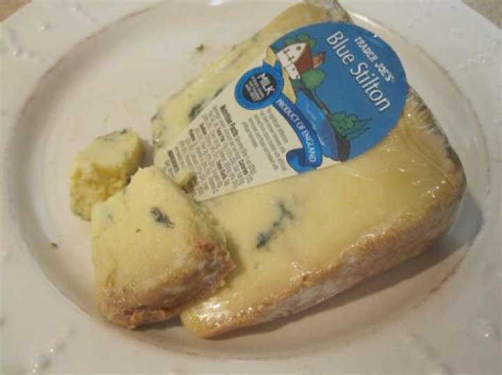 What are the blue veins in Stilton cheese?