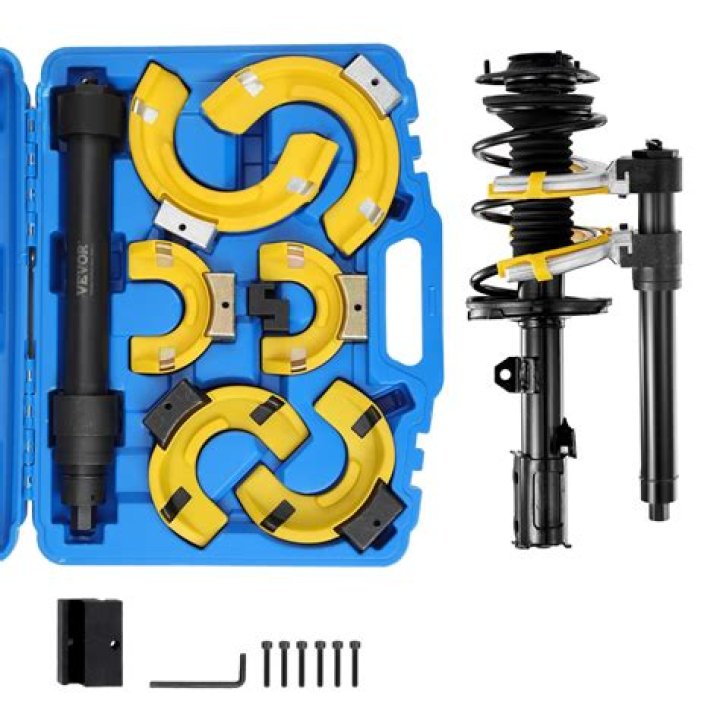 What is a strut spring compressor?