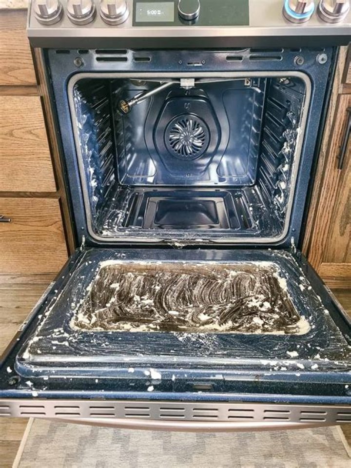 What is the best way to clean the inside of a microwave oven?