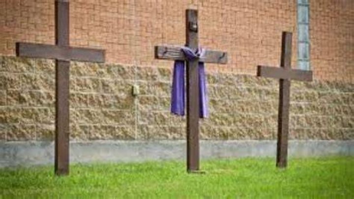 What is the significance of the cloth on the cross?