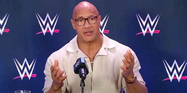 When did the rock debut WWE?