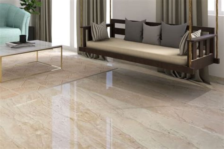 Where do you start laying tile in a room?