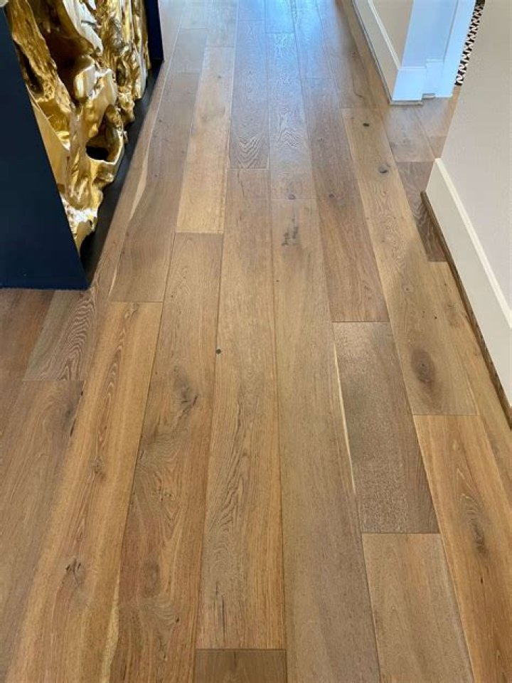 Which way do you lay hardwood flooring in a hallway?