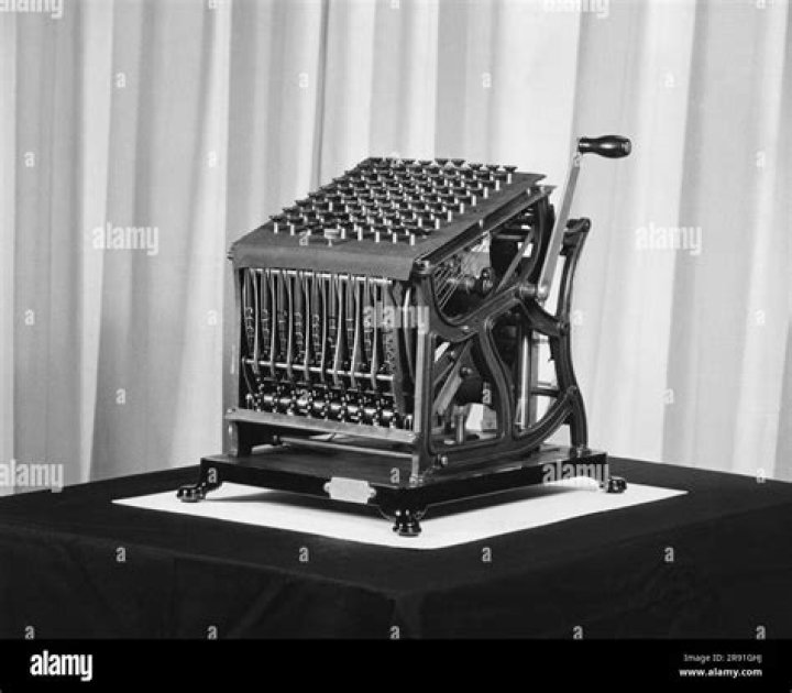 Who is the inventor of the first mechanical adding machine?