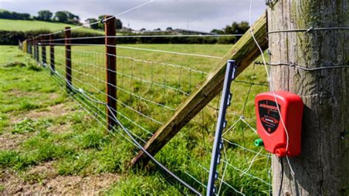 Why does an electric fence need to be grounded?
