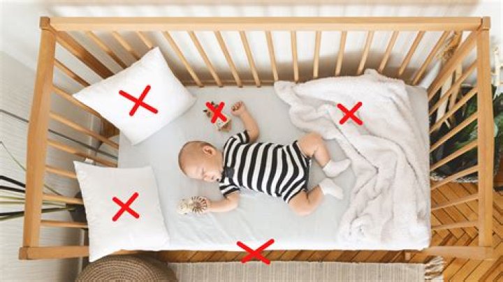 Why is soft bedding dangerous for babies?